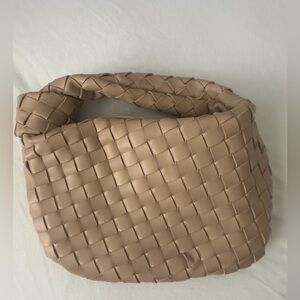 Basket weave style shoulder bag in cream color. Worn once. Gold hardware.